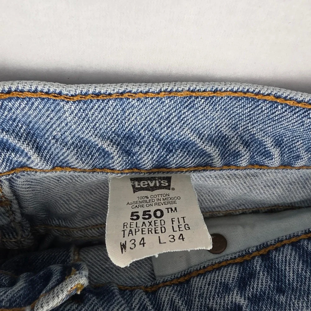 Vintage Levis 550 Orange Tab Relaxed Tapered Leg Light Wash Jeans 34x34 550-0213